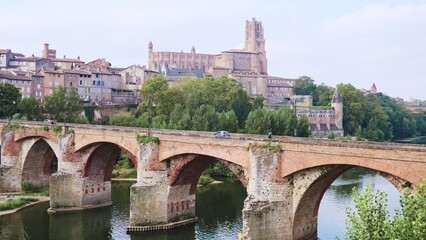 Wall Mural - Picturesque landscape with a view of the ancient bridge over the Tarn River in the city of Albi, France. High quality 4k footage