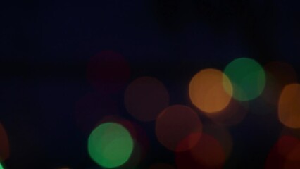 panoramic camera from left to right. flickering lights of festive illumination on the street close-u