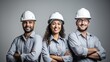 A Confident team of engineers, wearing hard plastic helmets, arms crossed, looking up, white isolated background.