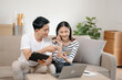 © laddawan - Portrait of success business people working together in home office. Couple teamwork startup concept.