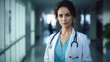 © Rusiru Dilshan  - Portrait of female doctor with stethoscope at hospital corridor.