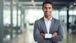 © CStock - Smiling young Indian businessman looking at camera