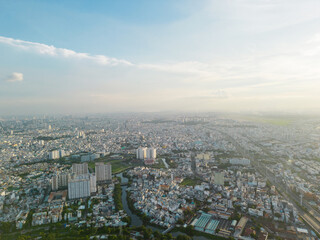 Wall Mural - Panoramic view of Saigon, Vietnam from above at Ho Chi Minh City's central business district. Cityscape and many buildings, local houses, bridges, rivers