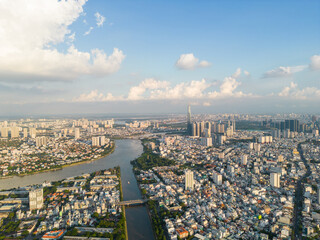 Wall Mural - Panoramic view of Saigon, Vietnam from above at Ho Chi Minh City's central business district. Cityscape and many buildings, local houses, bridges, rivers