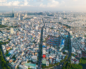 Wall Mural - Panoramic view of Saigon, Vietnam from above at Ho Chi Minh City's central business district. Cityscape and many buildings, local houses, bridges, rivers