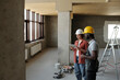 © Westend61 - Engineer using tablet PC and planning with coworker at construction site