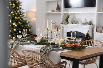 Wall Mural - Christmas table setting with festive decor and dishware in living room