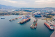 © Leonid - Aerial wide shot of Industrial port with container terminal with loading and unloading cargo ships