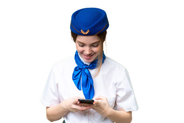 Poster - Airplane stewardess over isolated chroma key background sending a message with the mobile