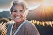 Elderly woman smiling happy and carefree at sunset
