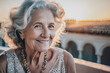 © Rojo - Elderly woman smiling happy and carefree at sunset