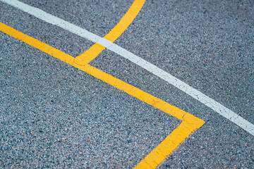 Outdoor basketball court lines and markings on concrete flooring, street ball abstract background