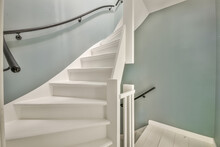 Bright Hallway With White Stairs