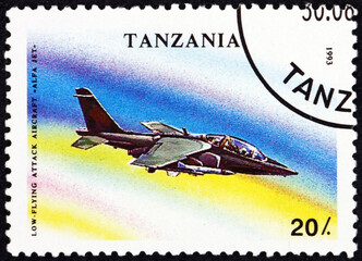 Wall Mural - Postage stamp Tanzania 1993 ALFA jet, military low-flying attack aircraft