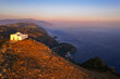© robertharding - White church of San Costanzo on top of a mountain surrounding the Amalfi coast at sunset, Punta Campanella, Massa Lubrense, Naples province, Campania