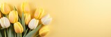 Fototapeta Tulipany - Soft Pastel hued Background with Yellow Tulip Bouquet for St Valentines Day Concept