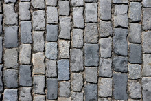 Dark Grey Cobblestone Pavement From Old Smooth Stones As Background Top View Close Up
