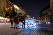 Horse carriages at night in main square in Krakow