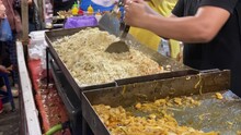 The Process Of Making Fried Rice Using A Flat Pan, A Delicious And Popular Indonesian Specialty Dish, Nasi Goreng.