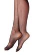 © Nobilior - Beautiful long woman's legs in black net pantyhose, isolated