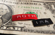Roth IRA labels macro on a dollar bill