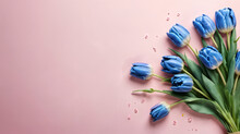 A Beautiful Bouquet Of Blue Tulips On A Delicate Pink Background