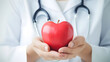 © HappyKris - Healthcare Concept with Doctor Holding Red Apple