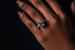© Lazylizard - Close up details of golden engagement ring with large dimond on woman's hand
