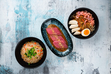 Wall Mural - Rice with chicken, dashi broth and tuna fillet with yuzu sauce and lemongrass.