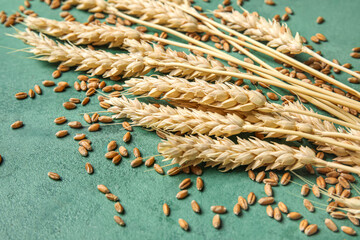 Wall Mural - Wheat ears with grains on grunge green background