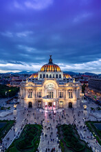 Aerial View Of Illuminated The Palace Of Fine Arts Know As "Palacio De Bellas Artes" Cultural Center In Mexico City, Built For Centennial Of The War Of Independence In 1910 Under Blue Sky At Night