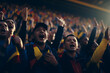 Romanian fans cheering on their team from the stands	
