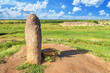 View of the ancient kurgan stela, stone idol against the backdrop of Kamyana Mohylain is an archaeological site, Zaporizhzhia Oblast, Ukraine