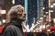 Handsome middle-aged man with gray hair and beard in a black jacket in the city at night