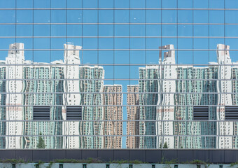 Poster - Reflection of high rise residential building of public estate on modern architecture in Hong Kong city
