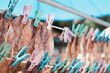 Dried squid hanging on rail for sell, close up. Thailand street food
