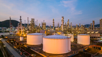 Sticker - Oil and gas industrial refinery at twilight, Oil refinery and Petrochemical plant pipeline steel, Refinery factory oil storage tank and pipeline steel at night.