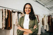 © (JLco) Julia Amaral - Portrait of a successful boutique owner standing with crossed arms