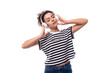© Ivan Traimak - young caucasian woman with curly haircut dressed in a striped summer t-shirt enjoys listening to music in anushniks