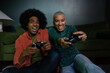 © ReeldealHD images - Couple playing a video game at home at night