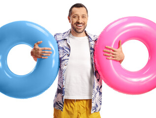 Sticker - Young man holding two swimming rings and a smiling