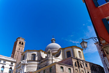 Scenic view of the old town of Venice with church tower of church Santi Geremia e Lucia and historic buildings on a cloudy summer day. Photo taken August 6th, 2023, Venice, Italy.