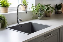 Kitchen Sink Area With Gray Modern Sink.