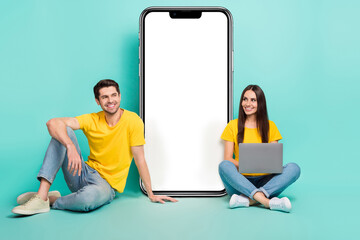 Aufkleber - Photo of dreamy cheerful married couple wear yellow t-shirts working looking gadget empty space isolated teal color background