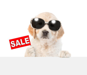 Poster - Funny Golden Retriver puppy wearing sunglasses holds signboard with labeled 