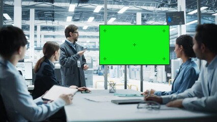 Poster - Electronics Factory Office Meeting: Caucasian Engineer Giving Presentation On TV With Green Screen Chromakey On Display. Diverse Colleagues Listening About Production Of Microchips, Motherboards.