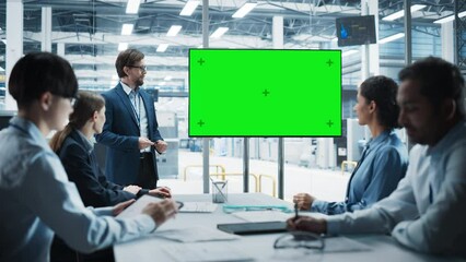 Poster - Electronics Factory Office Meeting: Caucasian Male Project Manager Presenting Innovative High-Tech Device On TV With Green Screen Chromakey. Diverse Engineers And Technicians Listening, Taking Notes.