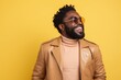 © Markus Schröder - Portrait of a blissful afro-american man in his 20s sporting a stylish leather blazer against a pastel yellow background. AI Generation