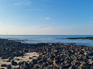 Sticker - This is a Jeju seascape with basalt rocks.