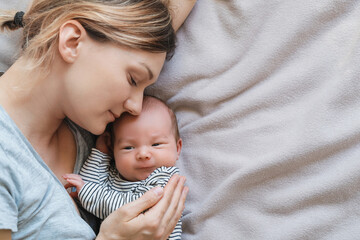 Mother and baby at home. Happy maternity and family.